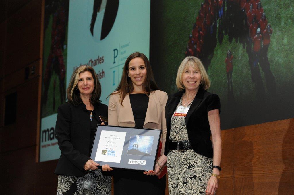 Lindsay Charles, PIA Law, accepts an award in recognition of PIA Law’s support of MADD Canada. Presenting the award are Angeliki Souranis, National President, MADD Canada (left) and Margaret Stanowski, Chair of the National Board of Directors.